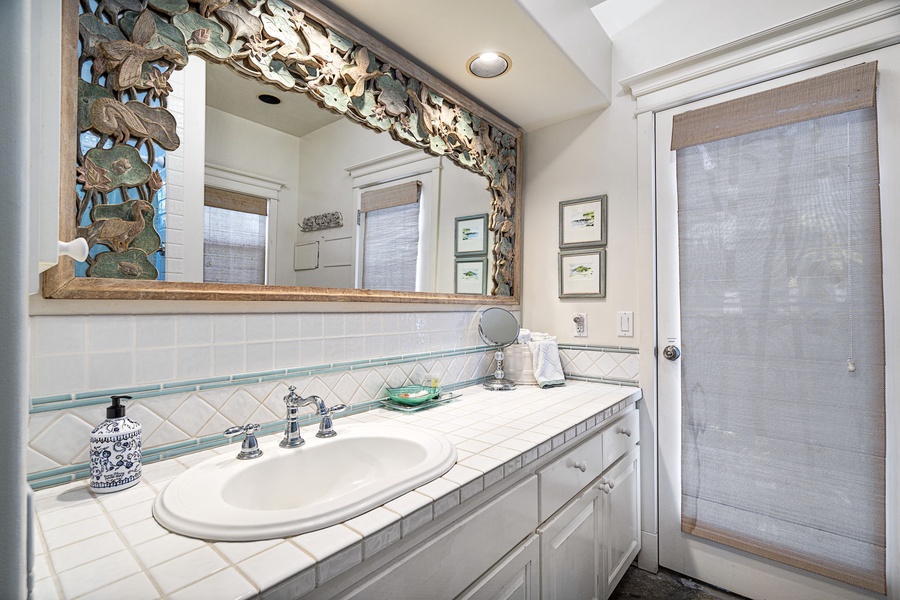 Ensuite bathroom features dual sinks and access to the outdoor shower.