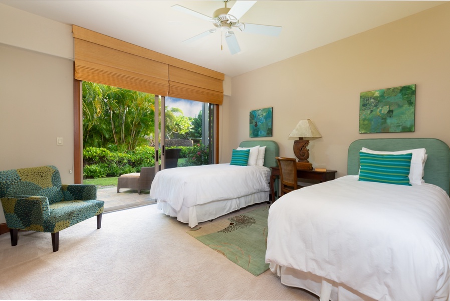 Lower level guest room with two twin beds (can convert to a king upon request) and private patio.