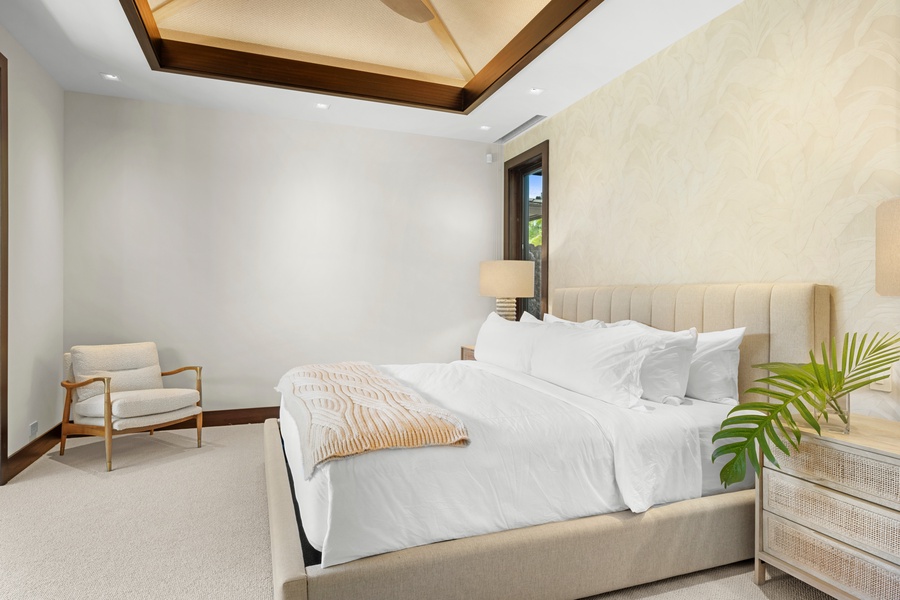 Guest Bedroom #4: Sink into crisp white linens and enjoy the serene ambiance of your elegant bedroom, featuring beautiful coffered ceilings and modern comfort.
