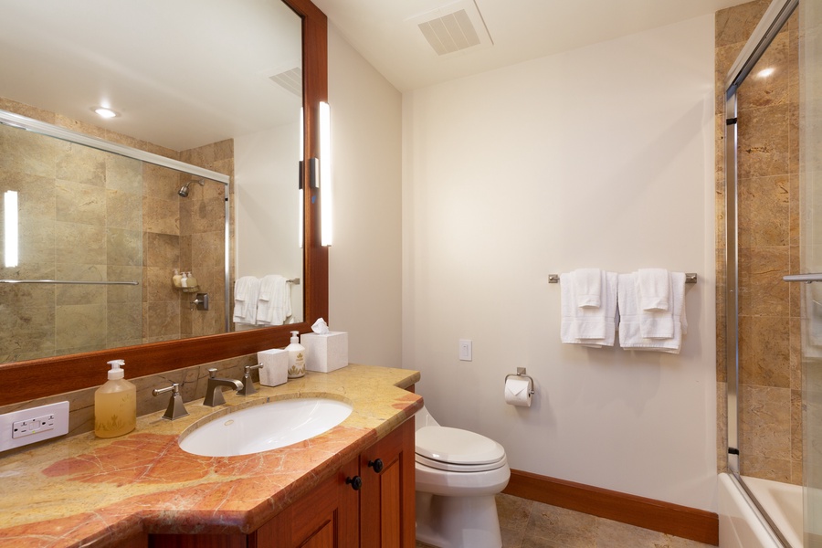 En suite bathroom with shower & tub combo