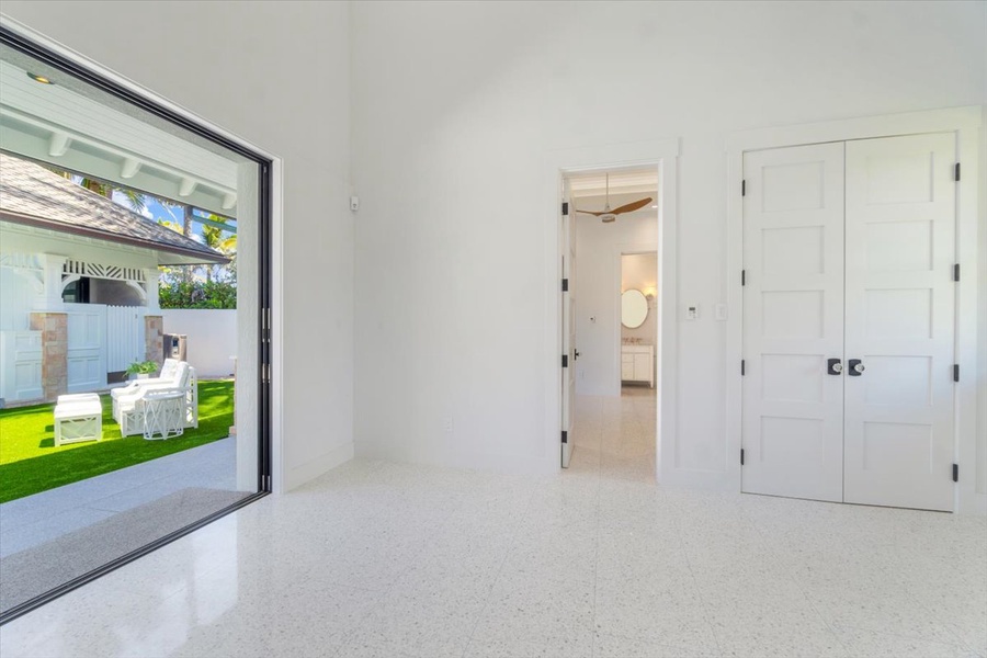 Spacious flex room with courtyard views and versatile potential for guests or work.