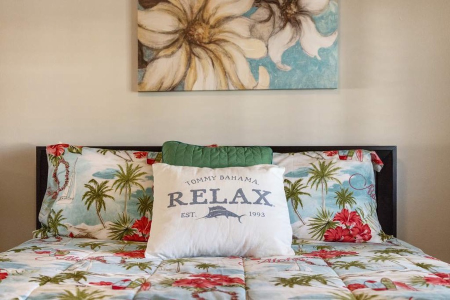 The guest bedroom with floral prints and a restful atmosphere.