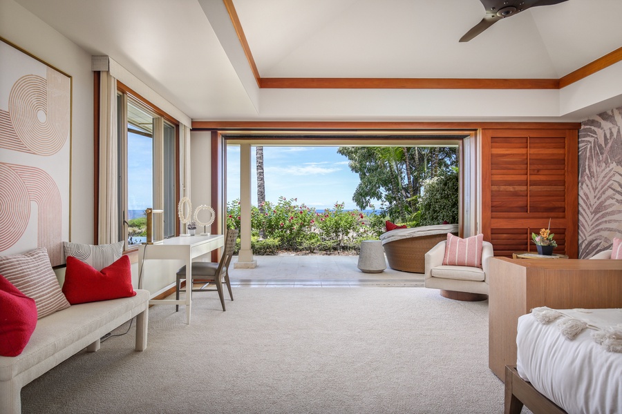 Ample seating including a desk + pocket doors to the primary suite’s own private lanai.