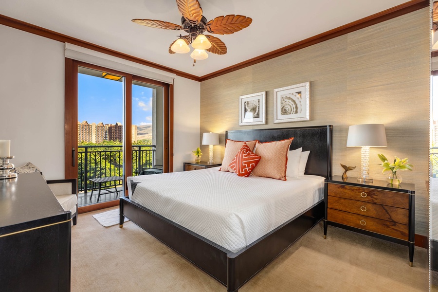 Luxurious primary suite boasting a king bed and a tailored walk-in closet, and access to private lanai.