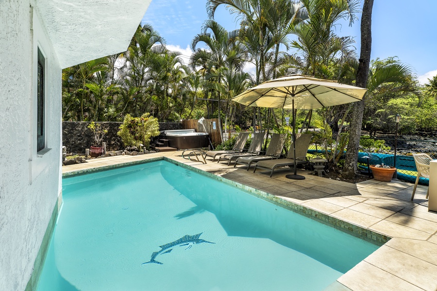 Soak in the solar-heated pool, relax in the hot tub, or read a book on one of the lounge chairs as palm trees sway nearby.