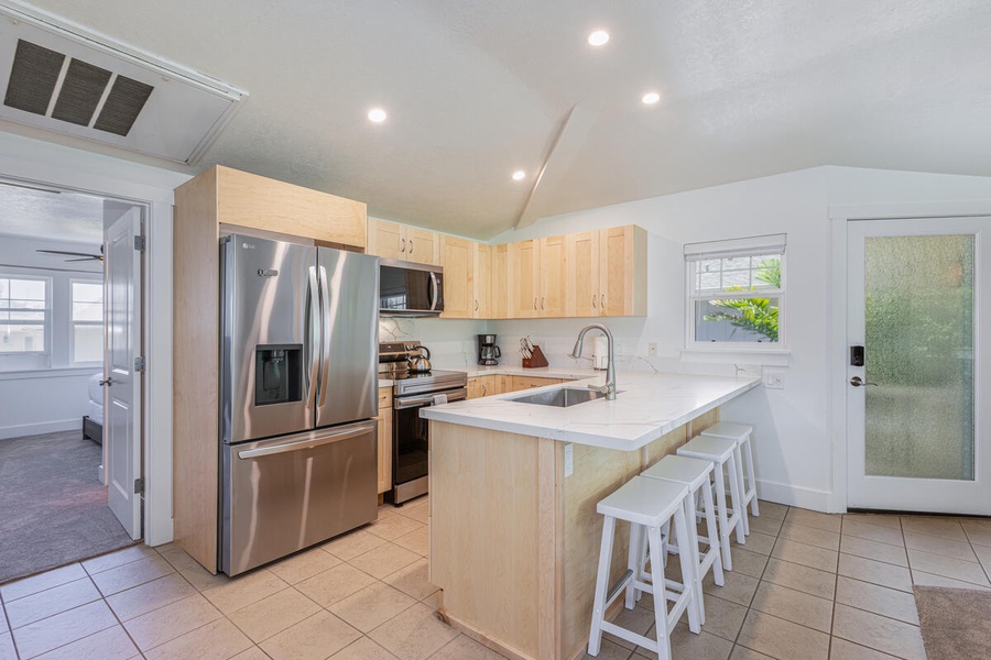 Modern kitchen with a spacious island and seating for 4.