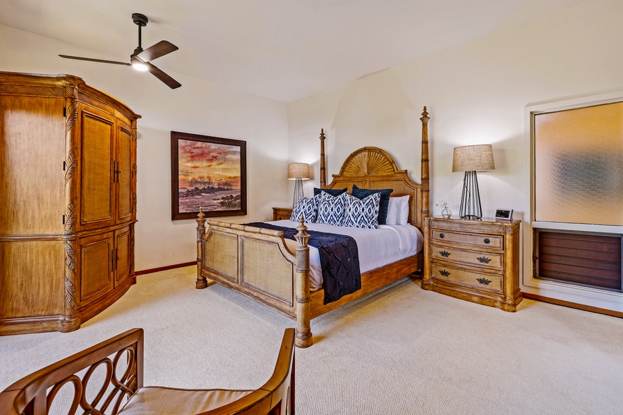 The primary suite at Kapalua Ridge 2321 features a king bed, chic decor, and calming island tones.