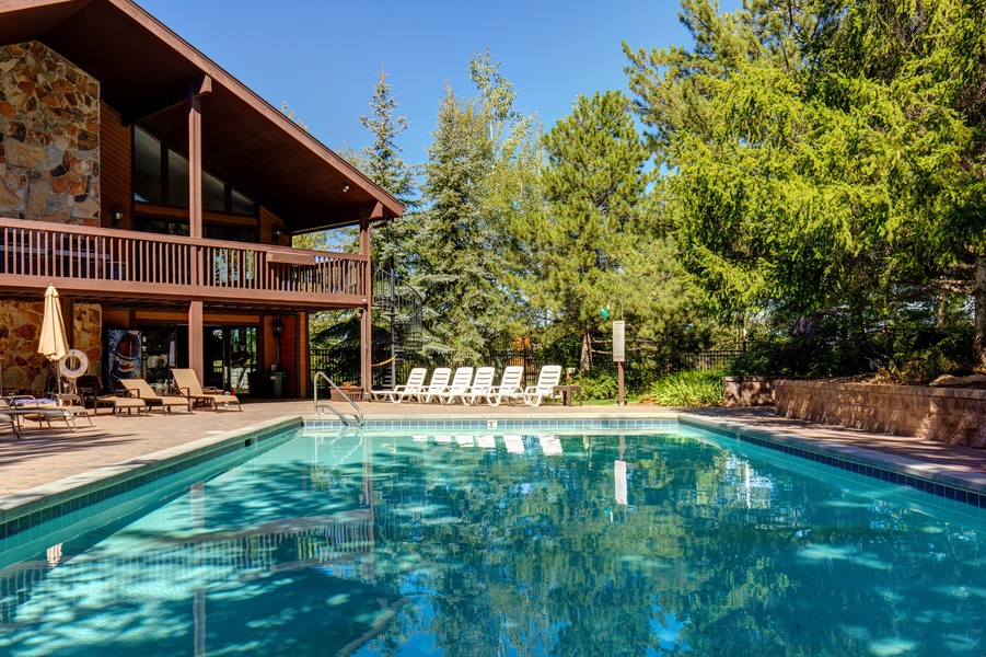 Condo amenities featuring the heated outdoor pools with lounge spaces