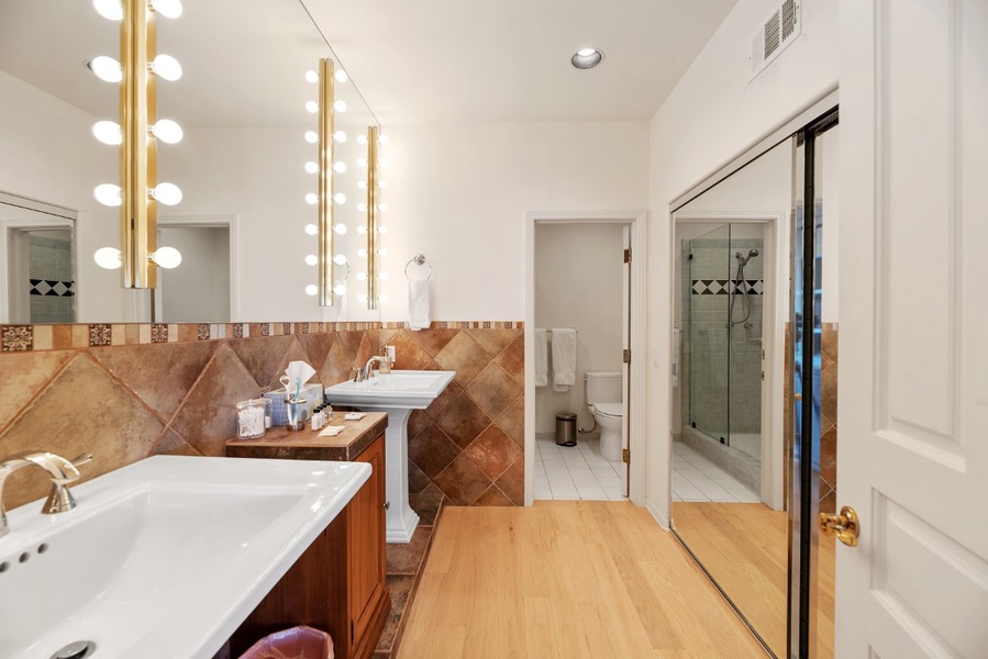 En suite bathroom #2 has ample closet space, double sinks and separate shower