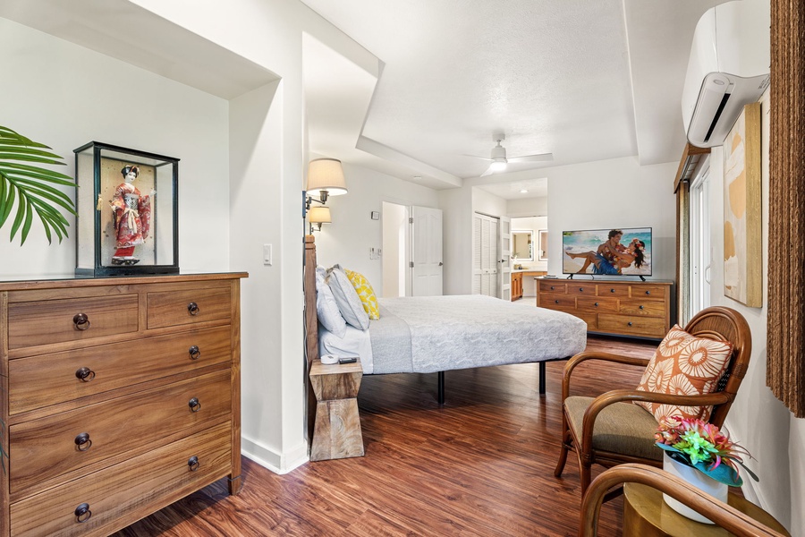 Drift into tropical dreams in your serene bedroom, where warm wood floors and island-inspired décor create the perfect retreat.