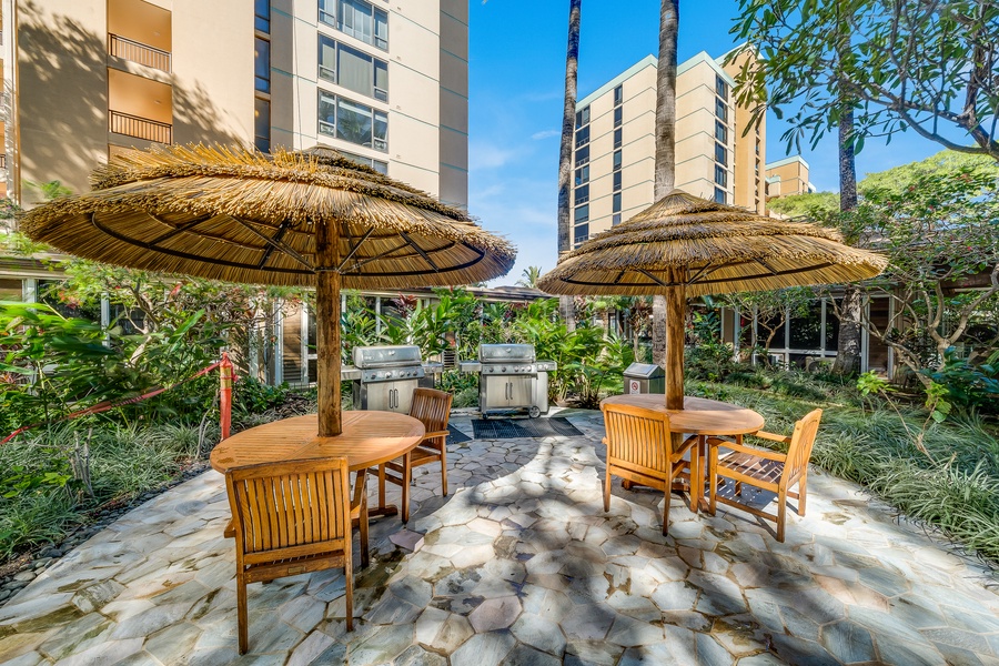 Mahana 1119 offers a shared BBQ area with shaded seating for outdoor meals.
