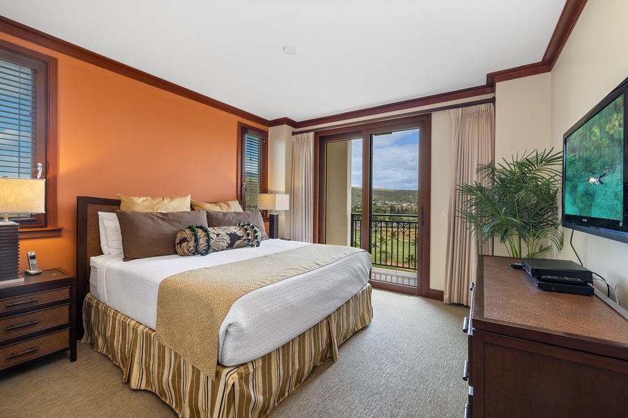 The primary guest bedroom has a luxurious king bed, TV, central AC and a private lanai access.