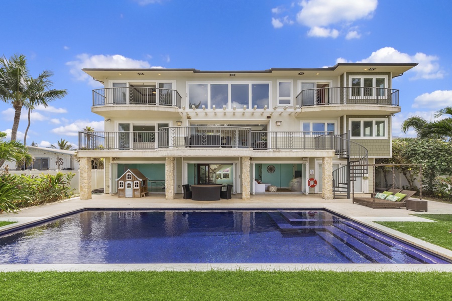 Beach view of the home, with first- and second-story entertaining areas