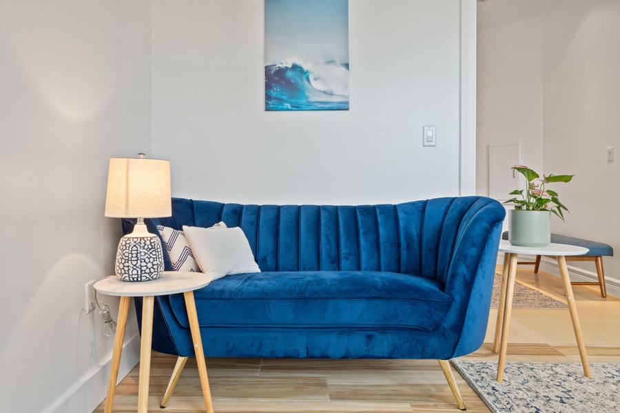 Vibrant blue couch corner; your cozy retreat with island vibes.