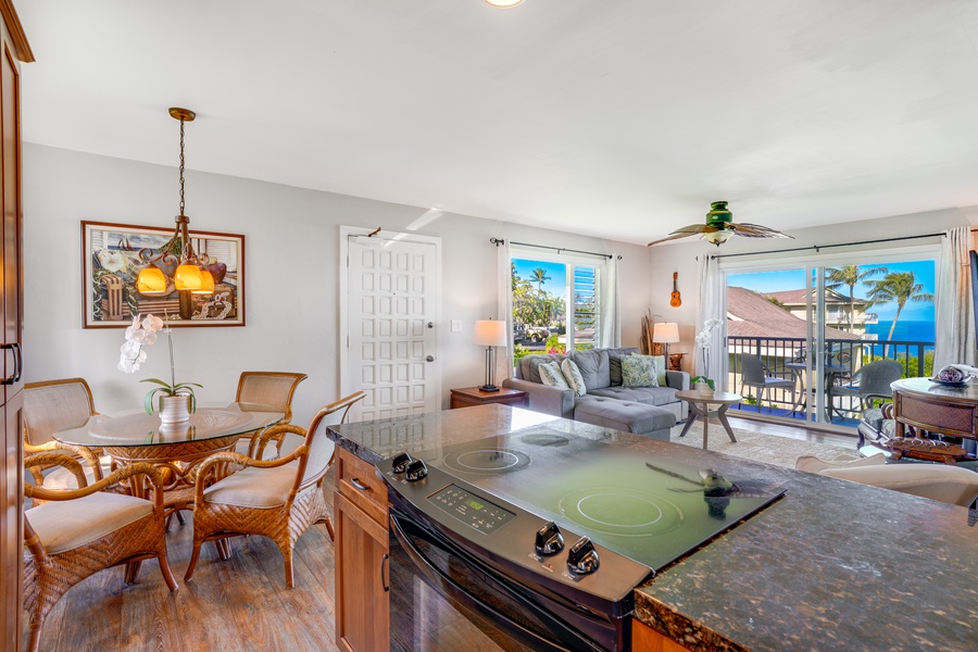 Meal prep is a delight in a kitchen that opens up to bright living spaces and relaxing views