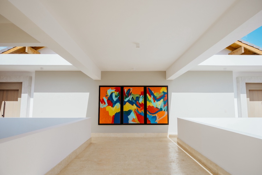 A colorful abstract art piece, adding a lively touch to the hallway.