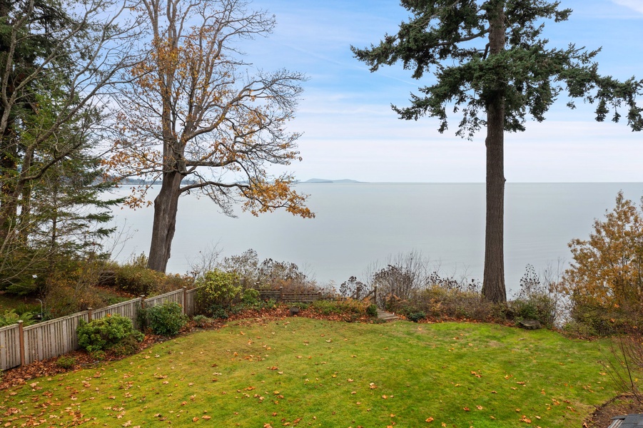 Feel the breeze and take in the serene bay views from the lush backyard—ideal for bird-watching or morning coffee.