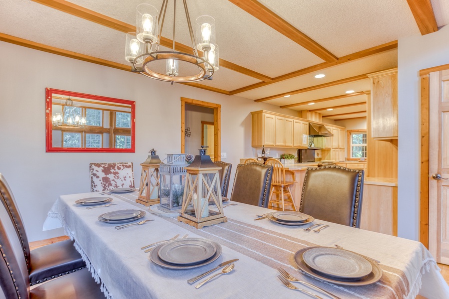 The open floor plan connects dining are and the well-appointed kitchen, perfect for entertaining.