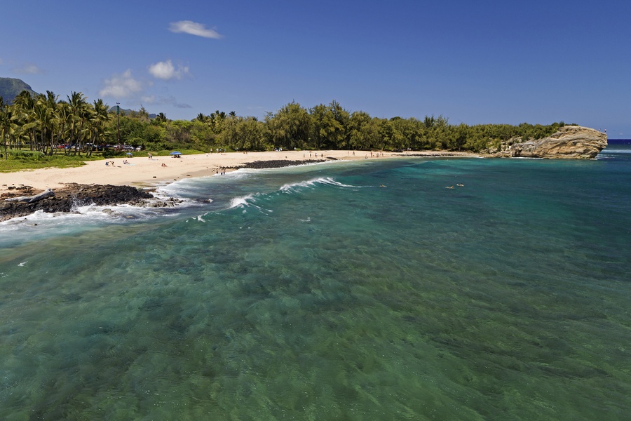 Take in the stunning aerial views of pristine waters and unspoiled coastlines at Shipwreck Beach.