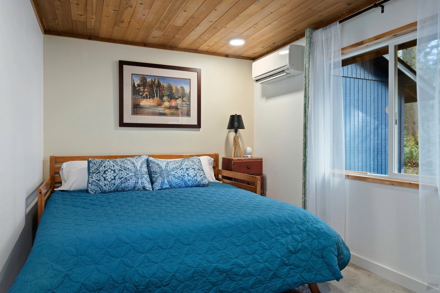 A peaceful retreat for restful nights, this room features garden views and calming natural textures.