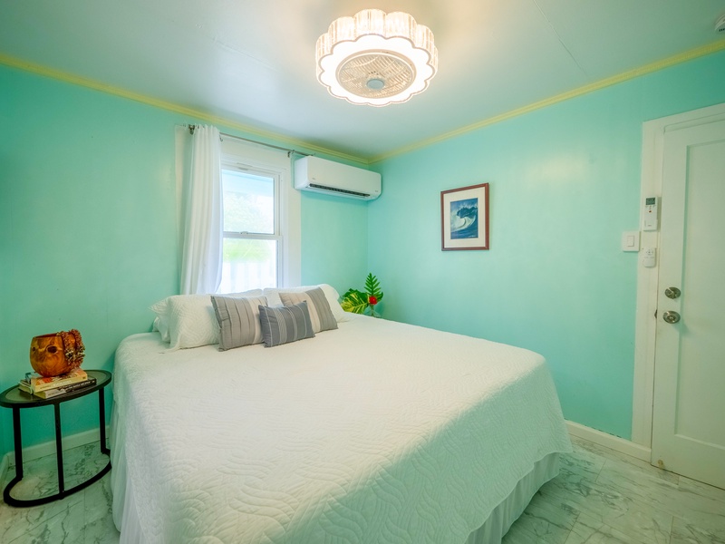 Drift into peaceful dreams in your serene mint-green bedroom, where soft natural light and coastal vibes create the perfect retreat.