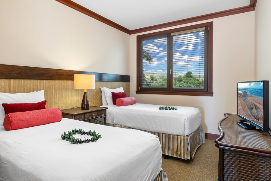 The third guest bedroom has twin beds that can be converted in to a king bed.