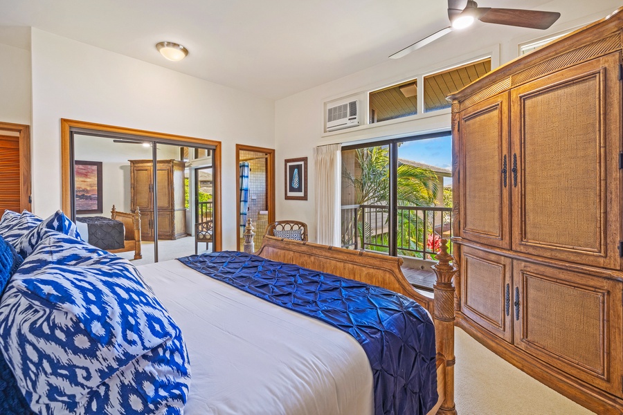 Wake up to serene views and natural light in this inviting primary bedroom, where you can step right onto the lanai for a breath of fresh air