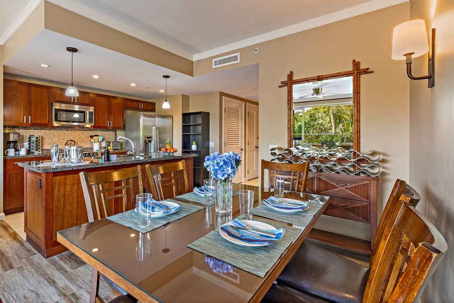 Gather for memorable meals at this elegant dining area, which features a sleek glass on top of wood table and comfortable seating.