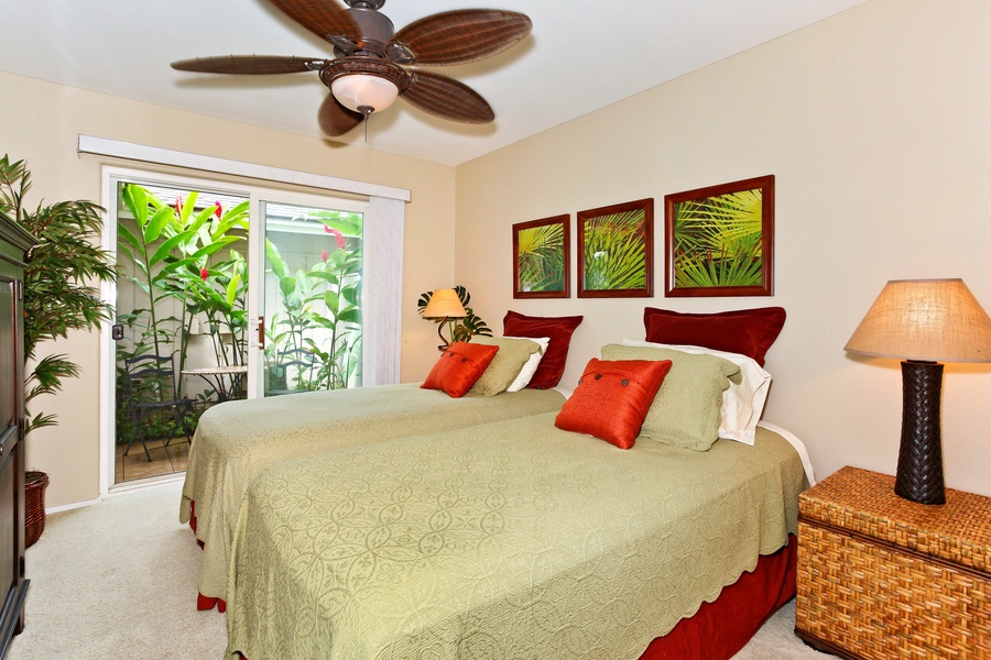 The beautiful second bedroom with twin beds and a private lanai.