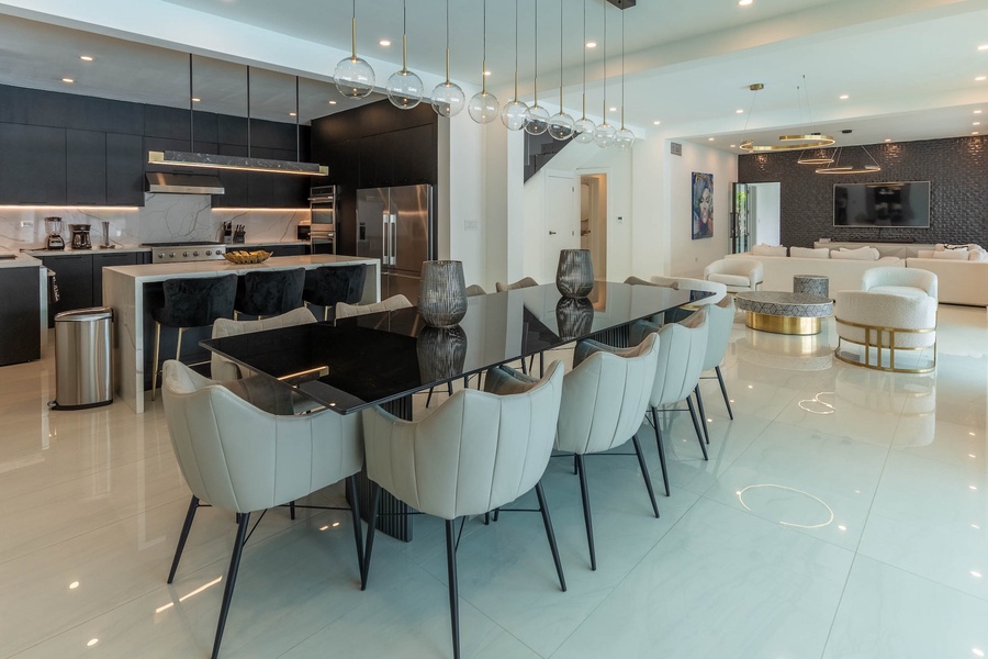 Gather and dine in the dining area with table for ten.