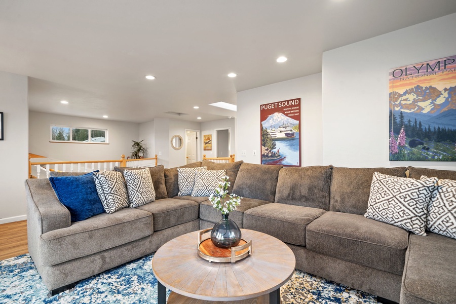 Sink into this plush sectional sofa where you can unwind after your adventures, surrounded by local artwork celebrating the Pacific Northwest's beauty.