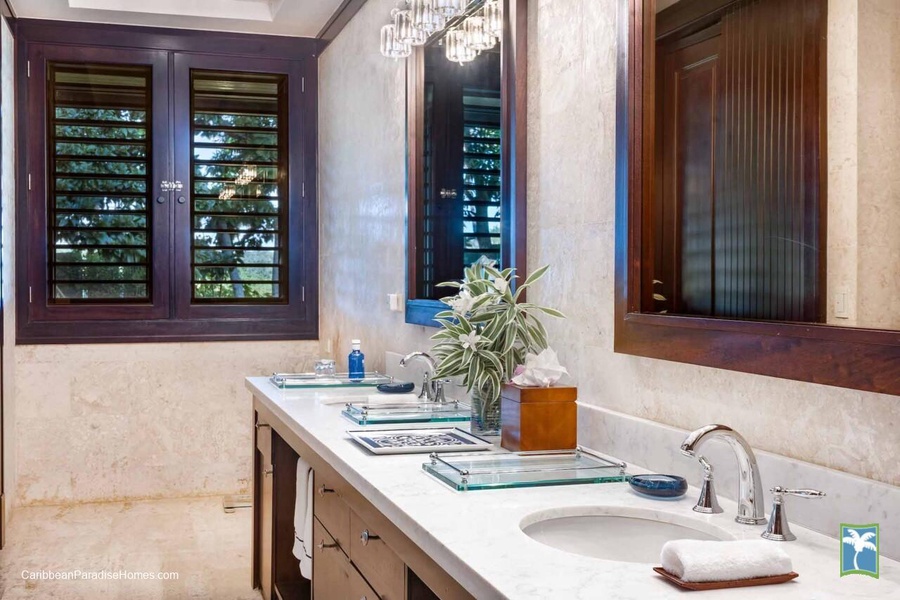Refresh in the ensuite bathroom with double sinks and ample counter space.