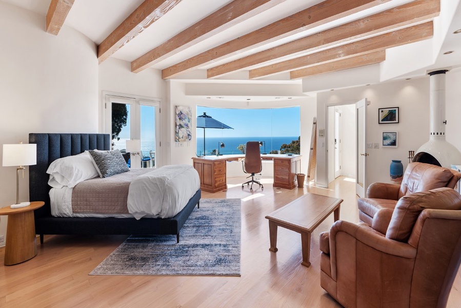 Bedroom #2 with commanding view of the ocean, curved glass and work area