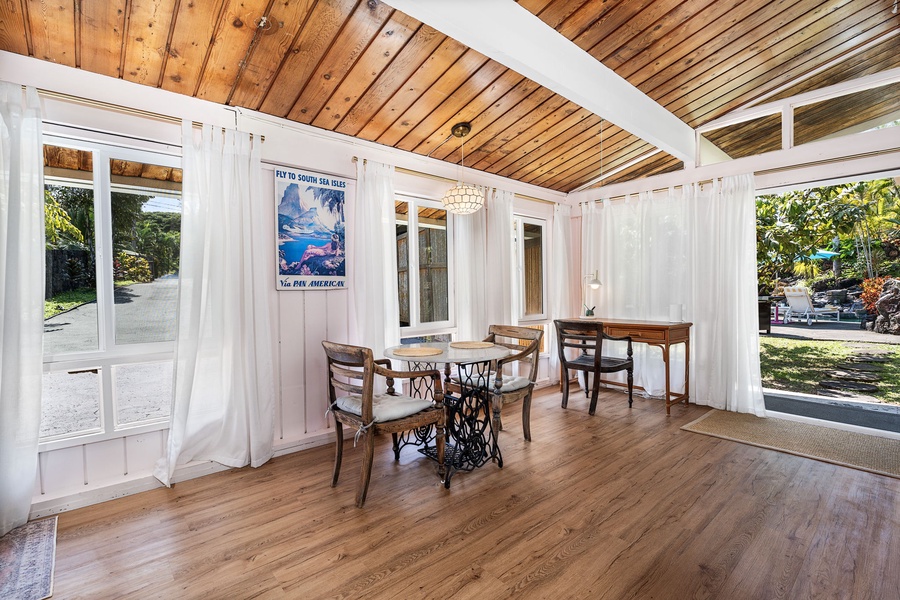 Step into your bright dining space with soaring wood ceilings, vintage charm, and French doors opening to the garden.