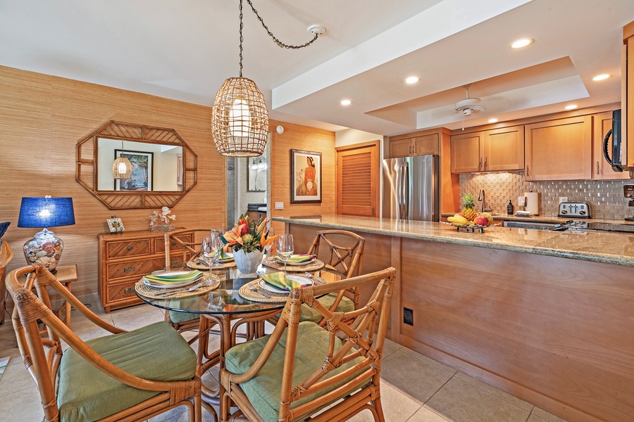 The dining area, with its tropical-inspired décor, is conveniently located next to the kitchen, making it easy to enjoy meals together.