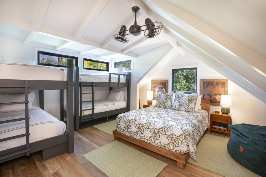 Third guest bedroom perfect for families, complete with ample sleeping arrangements and storage.