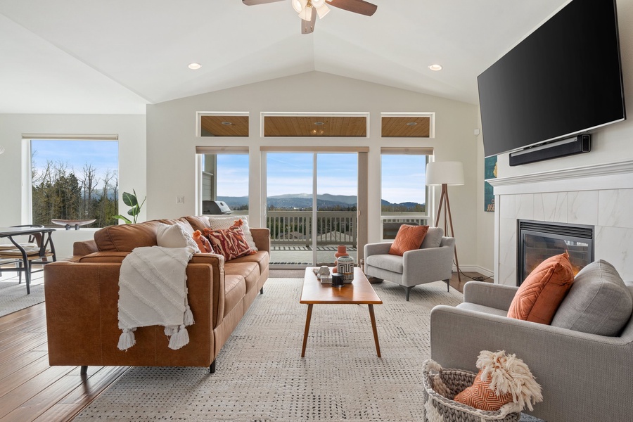 Nestled in comfort, the cozy living area seamlessly extends to the balcony, inviting the outdoors in for a serene retreat.