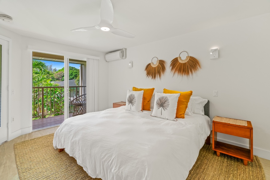Second guest suite features calming garden views and ensuite spa bath.