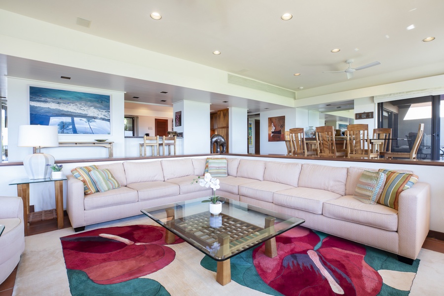 Spacious great room with a coastal color palette and ample seating, perfect for group gatherings and relaxation.
