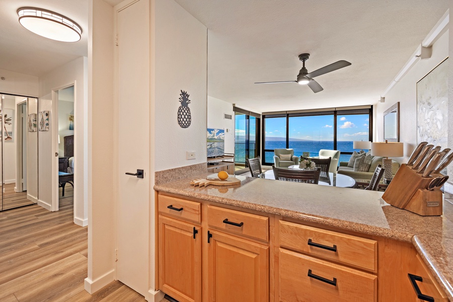 The kitchen's pass-through counter opens up to the living and dining area.