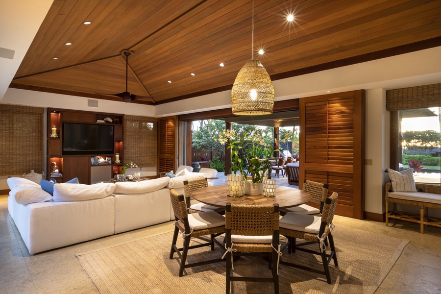 Dining area & great room illuminated as the sun sets