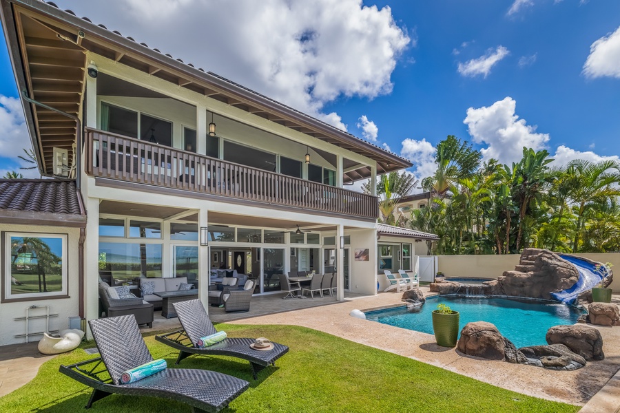 Outside of the house with a pool view.