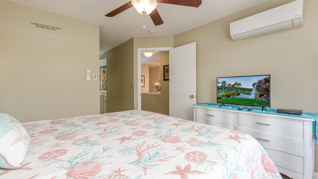 Relax in your comfortable bedroom with cheerful tropical bedding, flat-screen TV, and air conditioning to keep you cool.