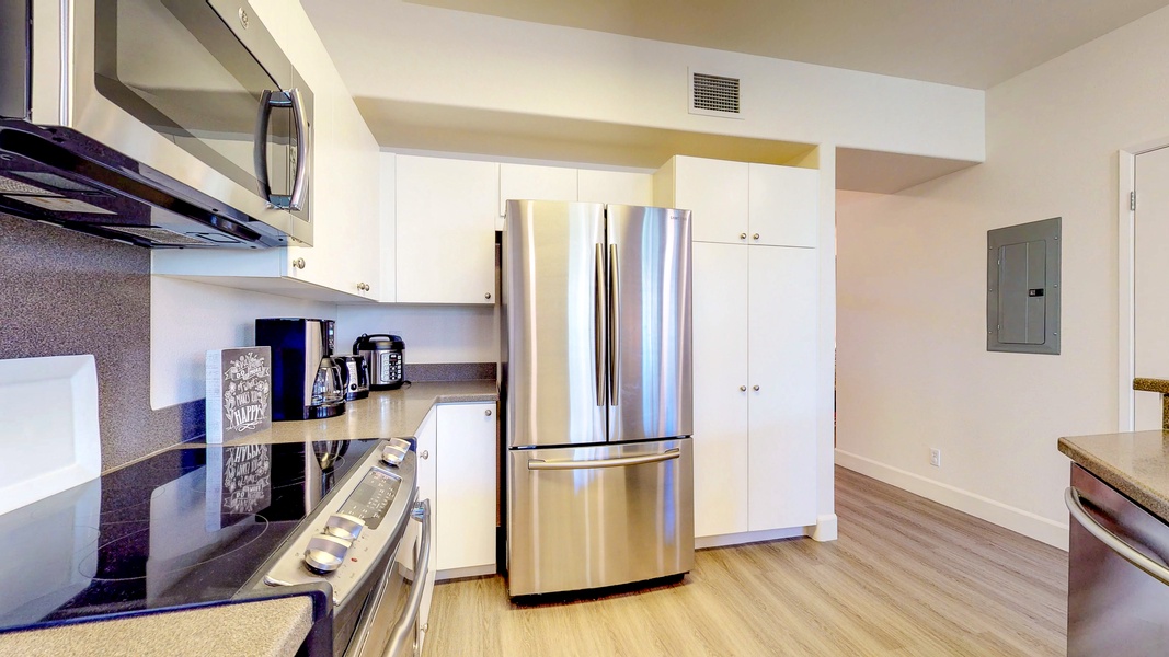 The spacious kitchen with stainless steel appliances.