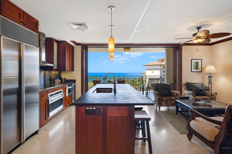 Open floor plan ensures a seamless flow from kitchen, dining, living and lanai areas.