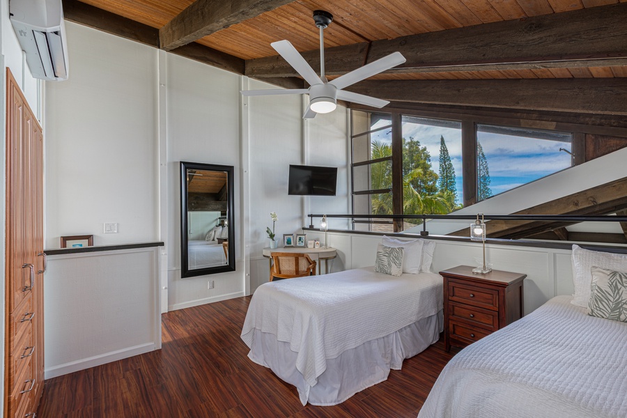 Versatile loft bedroom features twin-bed setup easily converts into a king—ideal for kids, friends, or couples.