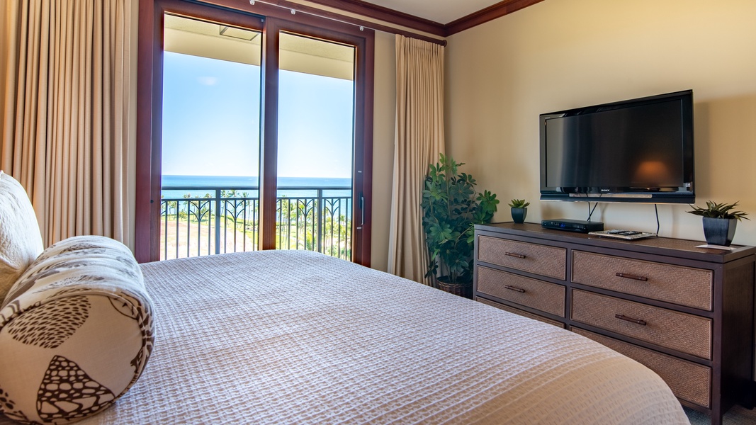 The primary guest bedroom has a dresser and TV for your convenience.