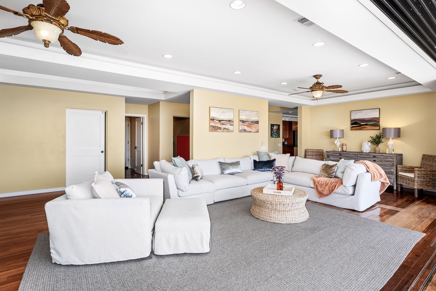 Spacious living room with plush seating, perfect for unwinding after a day of exploring