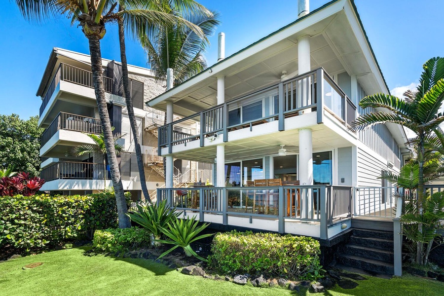 Exterior of the Hale Kai O'Kona unit with manicured landscaping.