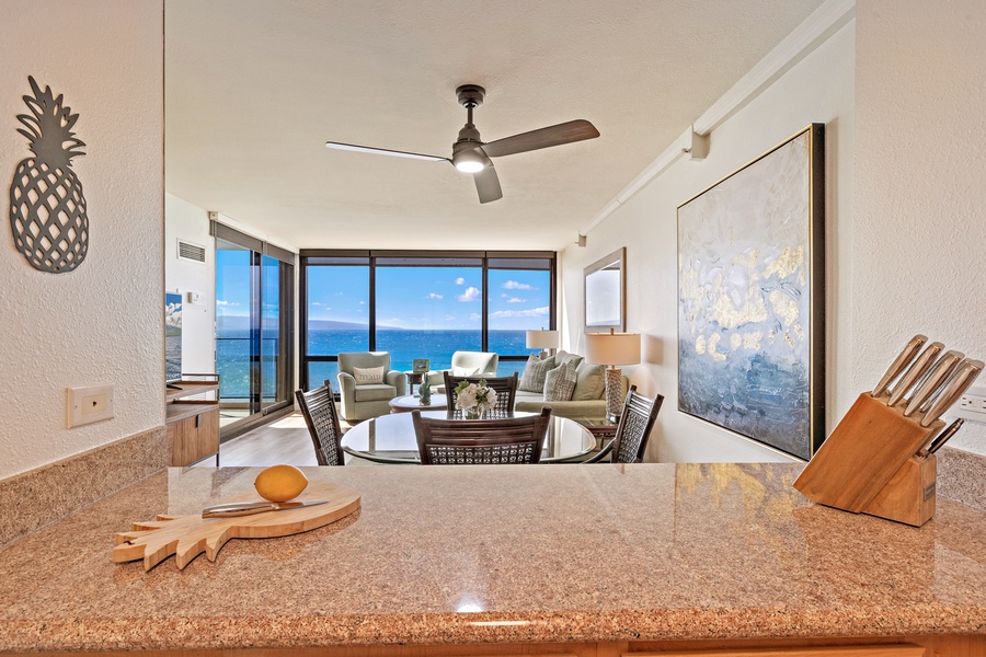 Relax and dine with stunning ocean views in Mahana 718’s open-concept living space.